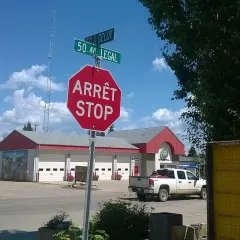 Legal's fire hall with a bilingual stop sign